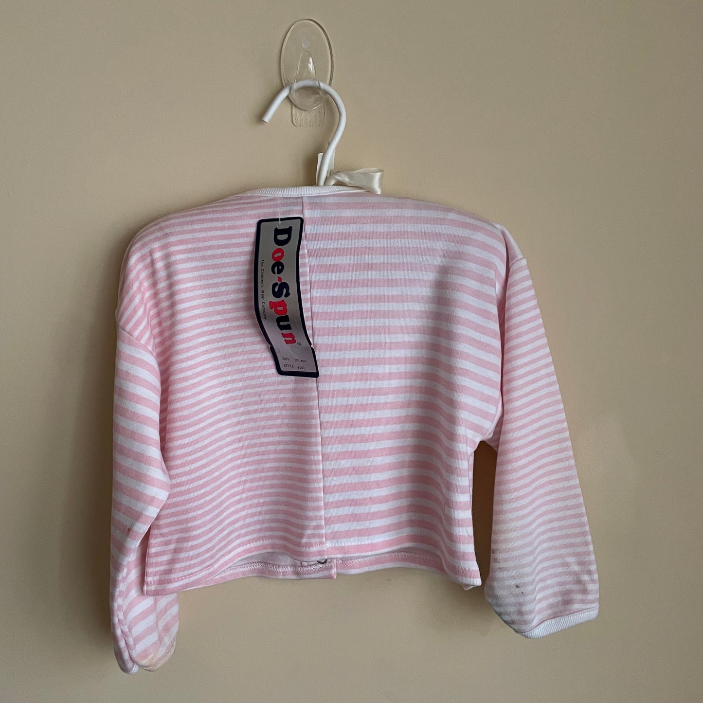 The back of the pink and white stripped cardigan. 